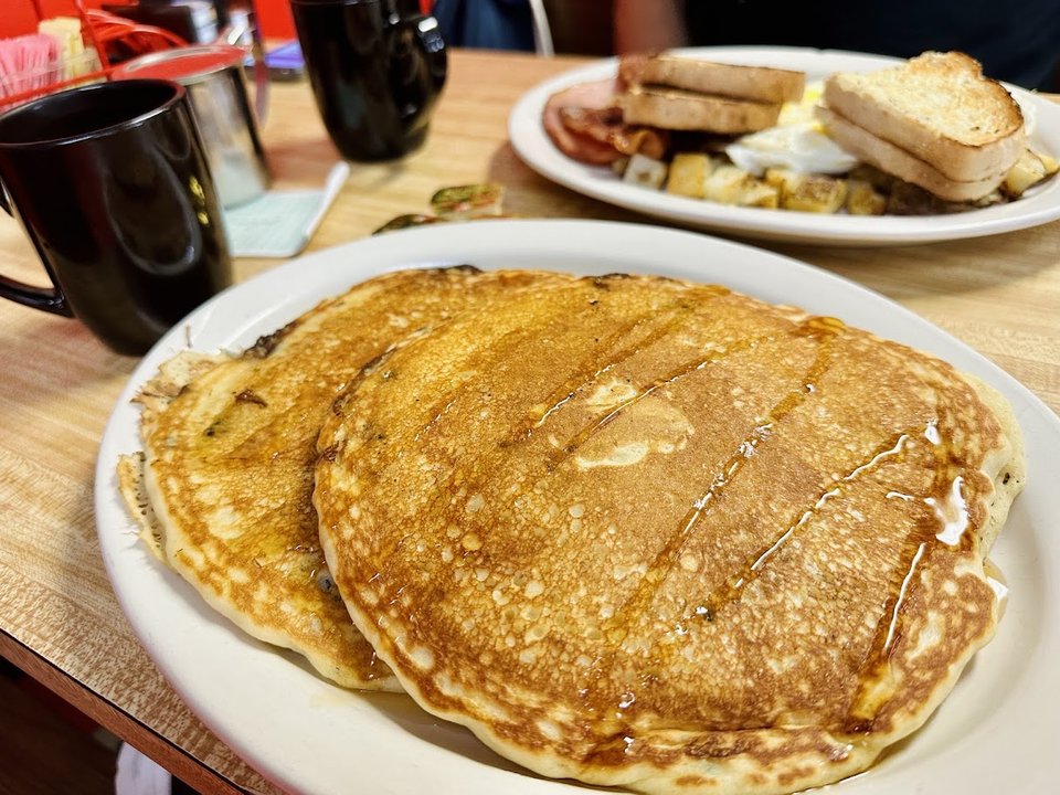 Breakfast plates on a simple diner table